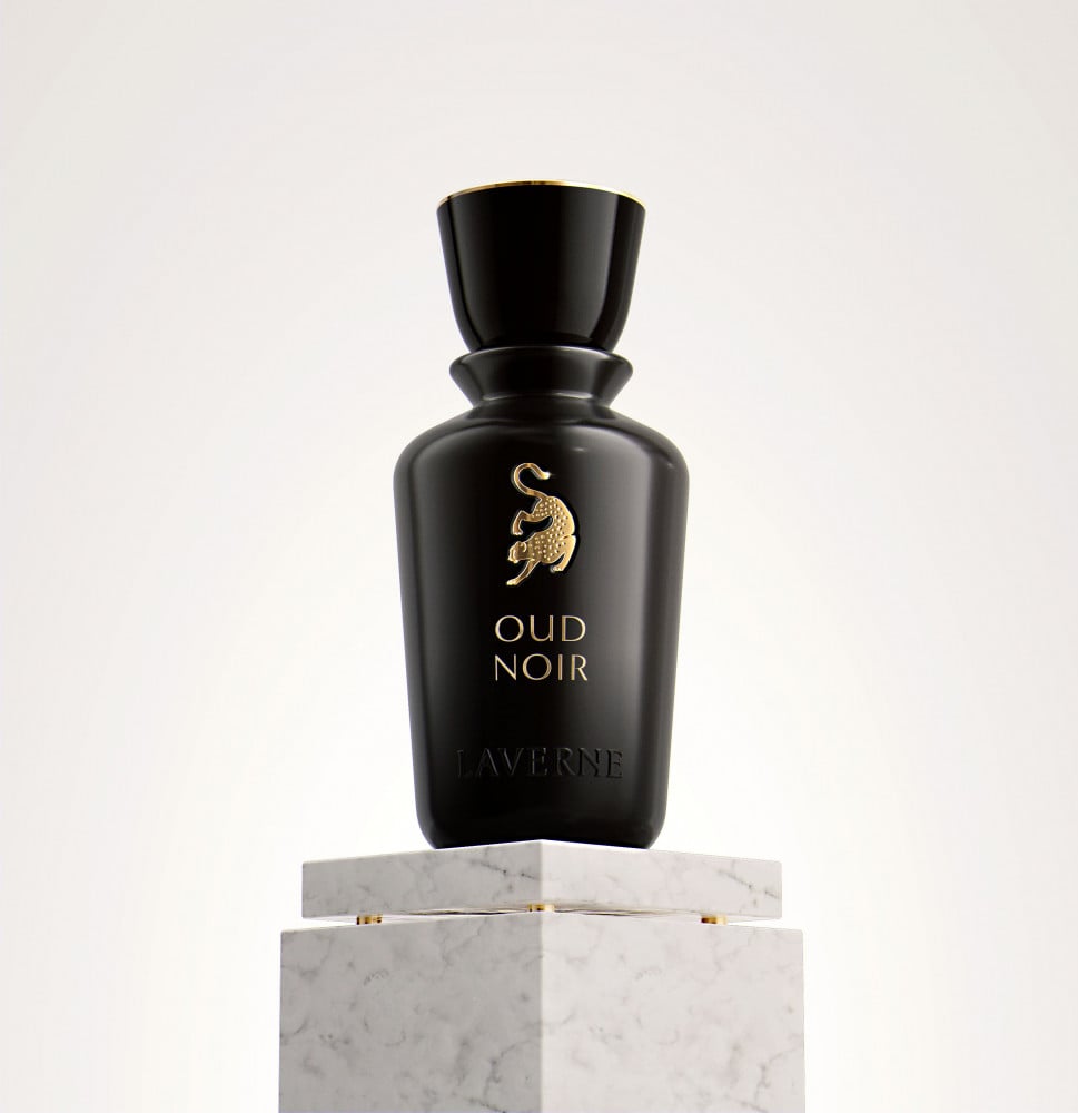Black perfume bottle for Laverne Oud Noir with a gold leopard logo, sitting on a white marble pedestal